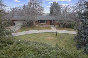 Home with view of circular driveway-Drone