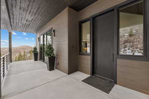 View of exterior entry with a mountain view