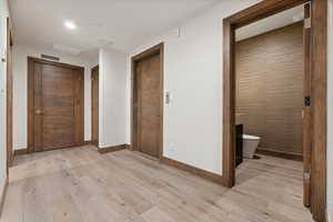 Hallway with Powder Room and elevator