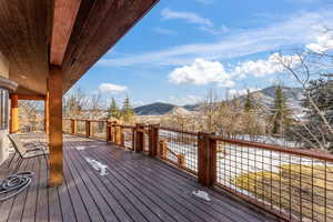 Wooden terrace featuring a mountain view