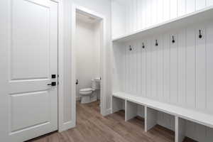 Mudroom with light hardwood / wood-style flooring