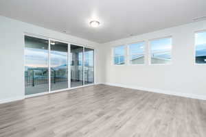 Empty room with light wood-type flooring