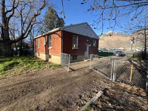 View of side of home featuring a mountain view