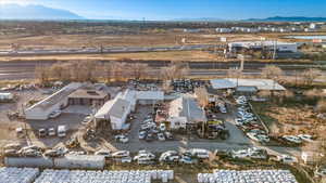 Snowy aerial view featuring a mountain view