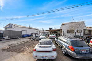 View of parking and front view of property