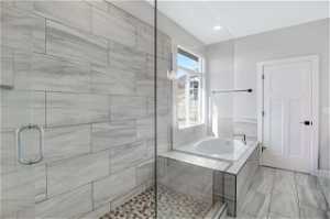 Primary bathroom with separate tub and walk-in shower
