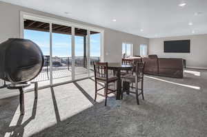 Dining space with light colored carpet