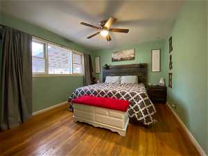 Master Bedroom featuring hardwood wood floors, large closet and ceiling fan