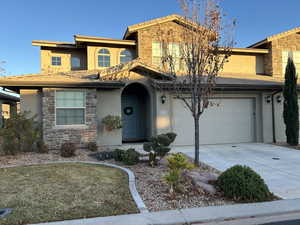 View of front of home featuring a garage