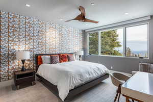 Bedroom featuring wallpapered walls, an accent wall, baseboards, ceiling fan, and recessed lighting