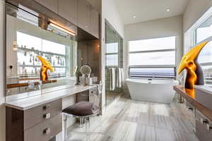 Full bathroom with a freestanding tub and vanity