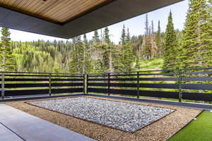 View of patio / terrace with a forest view