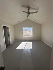 Primary bedroom with vaulted ceiling