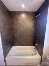 Bathroom featuring tiled shower / bath combo