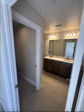 Primary bathroom with a shower and vanity