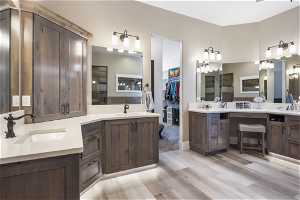 Owners Bathroom featuring double sink vanity and granite countertops