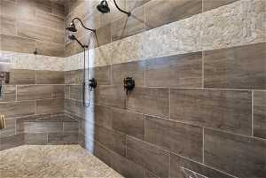 Owners Bathroom Walk-through double shower with a tile finish