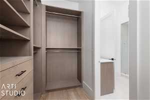 Walk in closet featuring light hardwood / wood-style floors