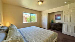 View of carpeted bedroom