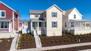 View of front of home with covered porch and a mountain view