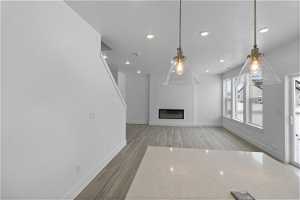 Living room/Dining Room with light hardwood / wood-style floors