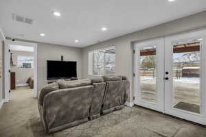 Ground level basement family room has covered patio access and natural light year round!