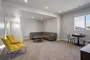 Living room with light colored carpet