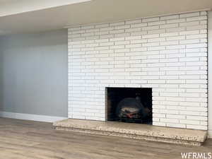 Room details with dark wood-type flooring and a fireplace