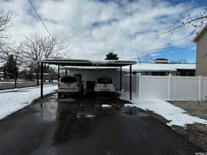 Exterior space featuring a carport