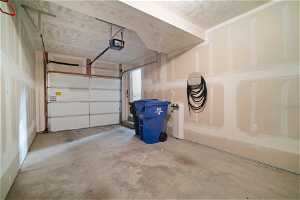 Tandem garage with water spigot, smart design garage door opener.