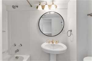 Bathroom featuring sink and shower / washtub combination