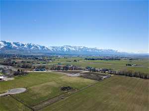Birds eye view of property with a rural view and a mountain view