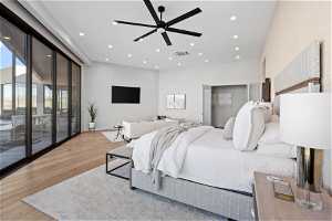 Bedroom featuring access to exterior, light hardwood / wood-style flooring, and ceiling fan