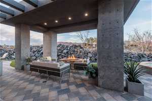 View of patio / terrace with an outdoor living space with a fire pit