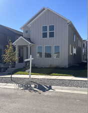 View of front of house featuring a front lawn