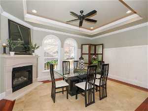 Formal dining room with fireplace and large windows