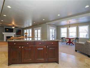Walkout Basement family room with kitchen, ,TV area with fireplace, and game/dining area