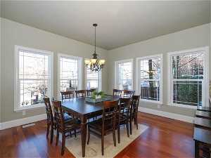Large informal dining area in main floor great room, surrounded by windows