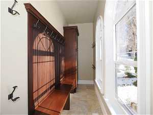 Mudroom with large windows, off foyer