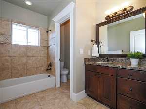 Second Floor Full bathroom with rich dark wood cabinetry and separate toilet room