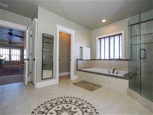 Large Primary Suite Bathroom with shower, separate bathtub, and separate toilet room