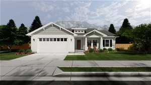 Craftsman inspired home with a garage, a front yard, and a mountain view