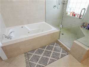 Primary Suite Bathroom with separate glass enclosed shower