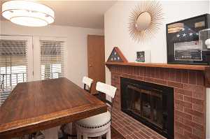 Dining room with a brick fireplace
