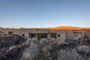 Back of property featuring a mountain view