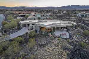 Aerial view at dusk featuring a mountain view