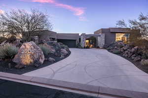 View of front facade featuring a garage