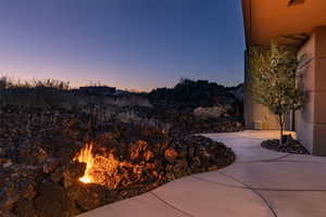 Patio terrace at dusk with a mountain view