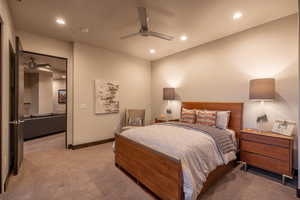 Carpeted bedroom with ceiling fan