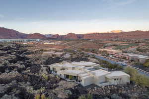 Aerial view at dusk featuring a mountain view